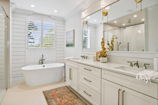 full bath featuring a sink, a healthy amount of sunlight, and a shower stall