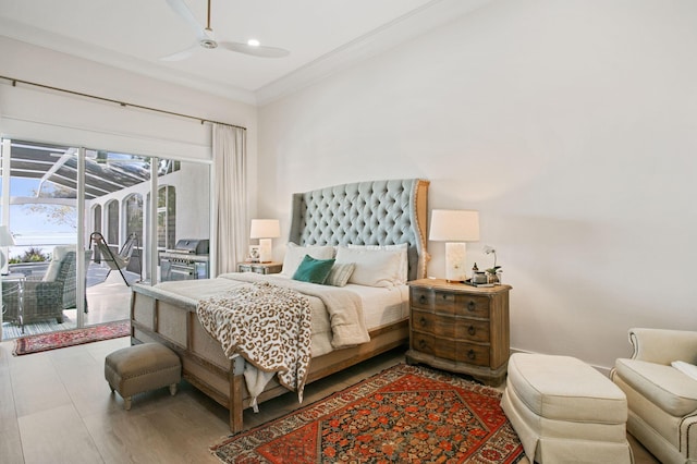 bedroom with access to exterior, a ceiling fan, and ornamental molding
