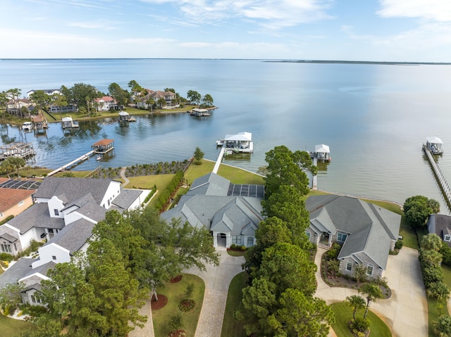 birds eye view of property featuring a residential view and a water view