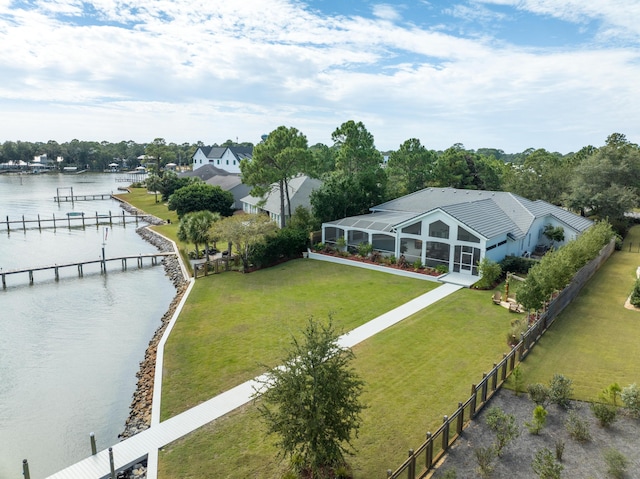 birds eye view of property with a water view