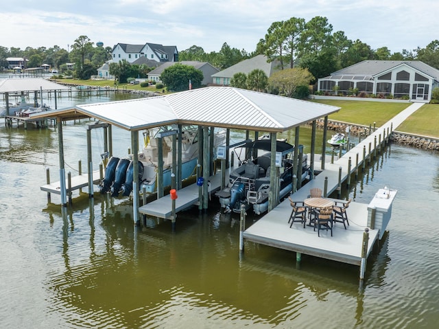 dock area with boat lift and a water view