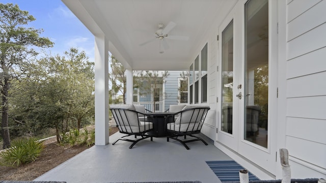 view of patio / terrace featuring outdoor dining area, ceiling fan, and french doors
