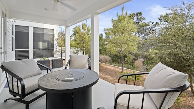 sunroom / solarium with an outdoor hangout area and ceiling fan