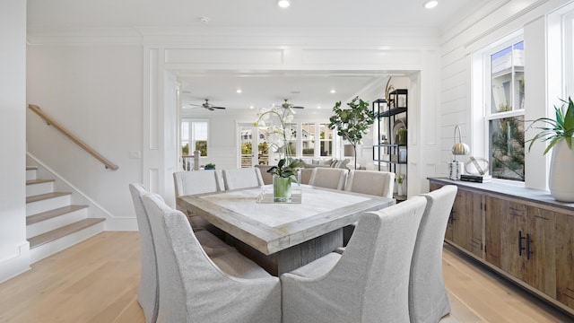 dining area with recessed lighting, ornamental molding, ceiling fan, light wood finished floors, and stairway