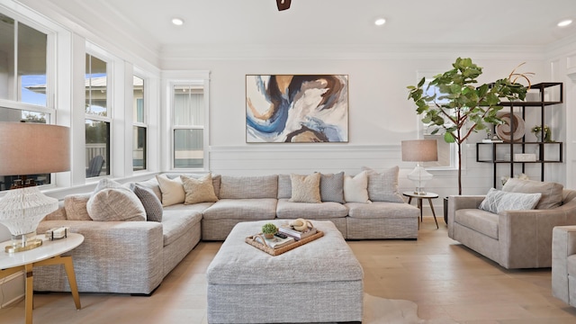 living room with crown molding, light wood finished floors, and recessed lighting