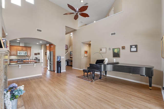 1124 Willowood Cir, Gulf Breeze, FL 32563 - entryway with arched walkways, visible vents, light wood-type flooring, and ceiling fan