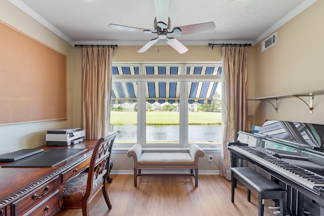 1124 Willowood Cir, Gulf Breeze, FL 32563 - office space featuring crown molding, ceiling fan, light wood-style flooring, visible vents, and a water view