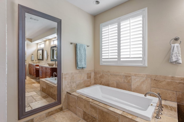 1124 Willowood Cir, Gulf Breeze, FL 32563 - bathroom with stone tile flooring, a bath, and vanity