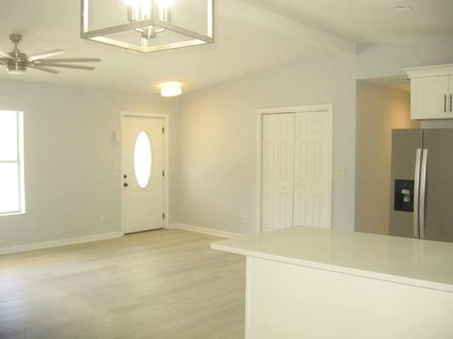 13 Plantation Way, Santa Rosa Beach, FL 32459 - entrance foyer with ceiling fan, light wood-type flooring, baseboards, and lofted ceiling with beams
