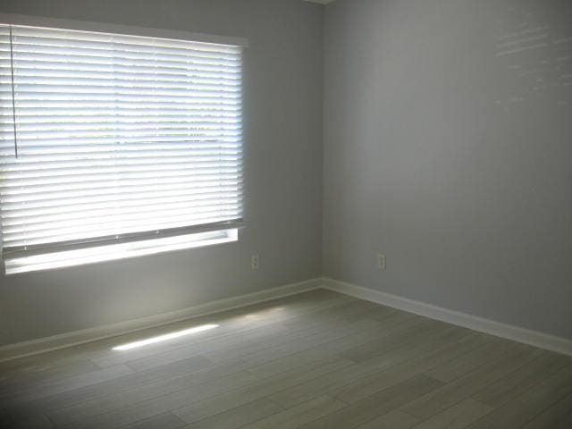 13 Plantation Way, Santa Rosa Beach, FL 32459 - spare room with baseboards and wood finished floors