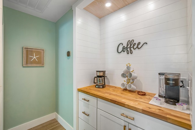 52 Secret Harbor Dr, Miramar Beach, FL 32550 - bar featuring wood finished floors and baseboards