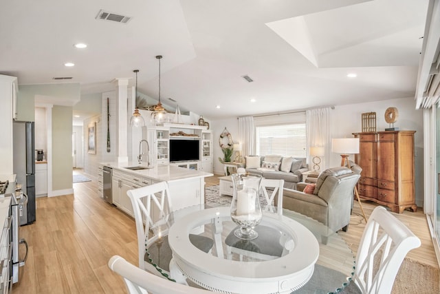 52 Secret Harbor Dr, Miramar Beach, FL 32550 - dining space with light wood-style floors, lofted ceiling, and recessed lighting