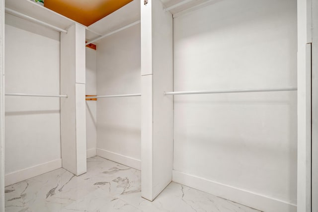 52 Secret Harbor Dr, Miramar Beach, FL 32550 - walk in closet featuring marble finish flooring