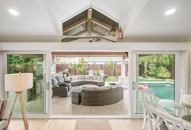 52 Secret Harbor Dr, Miramar Beach, FL 32550 - living area featuring healthy amount of natural light, lofted ceiling, and wood finished floors