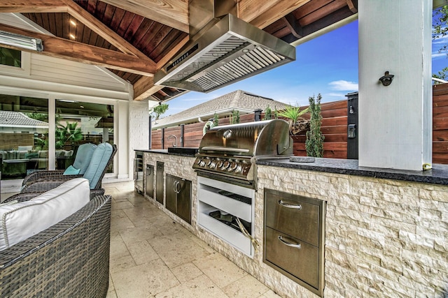 52 Secret Harbor Dr, Miramar Beach, FL 32550 - view of patio with exterior kitchen, a grill, and an outdoor hangout area
