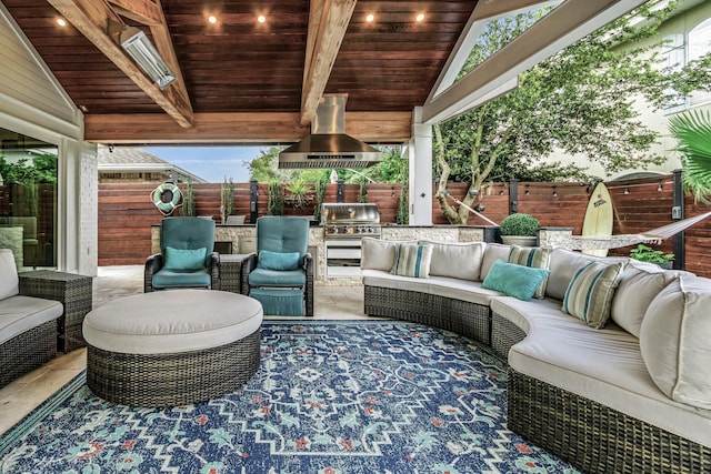 52 Secret Harbor Dr, Miramar Beach, FL 32550 - view of patio with an outdoor living space, exterior kitchen, a fenced backyard, and area for grilling