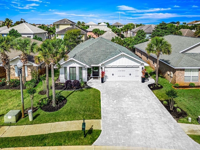 52 Secret Harbor Dr, Miramar Beach, FL 32550 - ranch-style home featuring a garage, decorative driveway, a residential view, and a front lawn