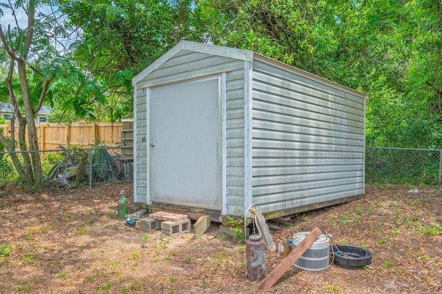 view of shed with a fenced backyard