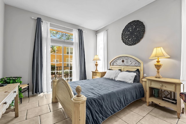 tiled bedroom featuring access to exterior