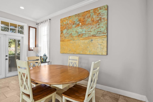dining area featuring baseboards, ornamental molding, and recessed lighting