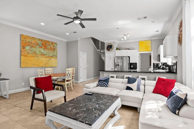 living area featuring crown molding, ceiling fan, baseboards, and visible vents