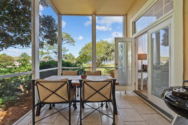 sunroom featuring tile patterned floors