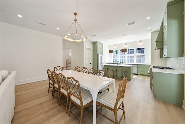 272 Beach Bike Way, Seacrest, FL 32461 - dining space featuring light wood-style floors, a chandelier, baseboards, stairway, and recessed lighting