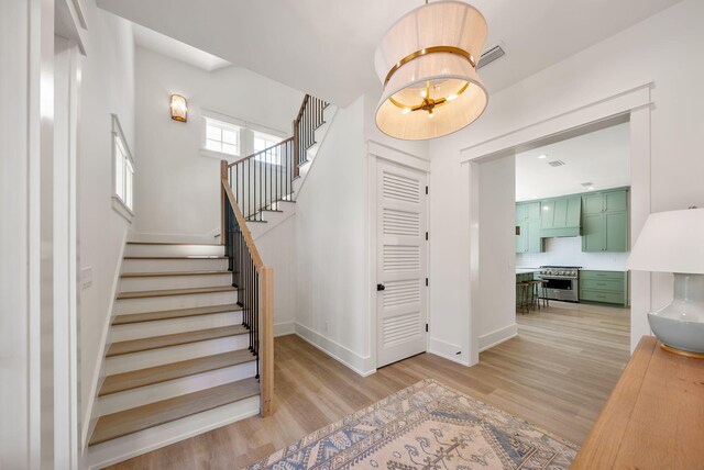 272 Beach Bike Way, Seacrest, FL 32461 - stairway featuring wood finished floors and baseboards