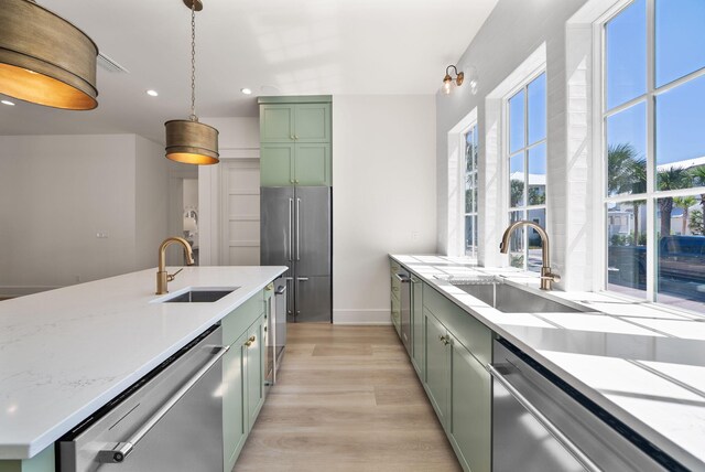 272 Beach Bike Way, Seacrest, FL 32461 - kitchen featuring green cabinets, appliances with stainless steel finishes, a sink, light wood-style floors, and recessed lighting