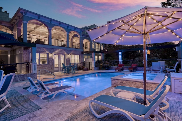 21 S Anchors Lake Dr, Santa Rosa Beach, FL 32459 - pool at dusk with an outdoor pool, a patio area, ceiling fan, and an in ground hot tub