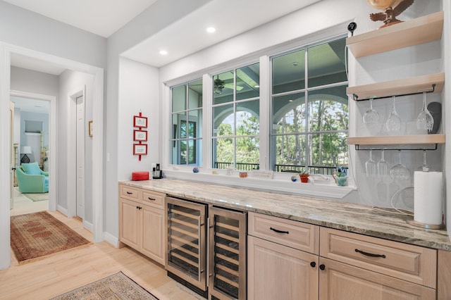 21 S Anchors Lake Dr, Santa Rosa Beach, FL 32459 - bar with bar area, light wood-type flooring, beverage cooler, and baseboards