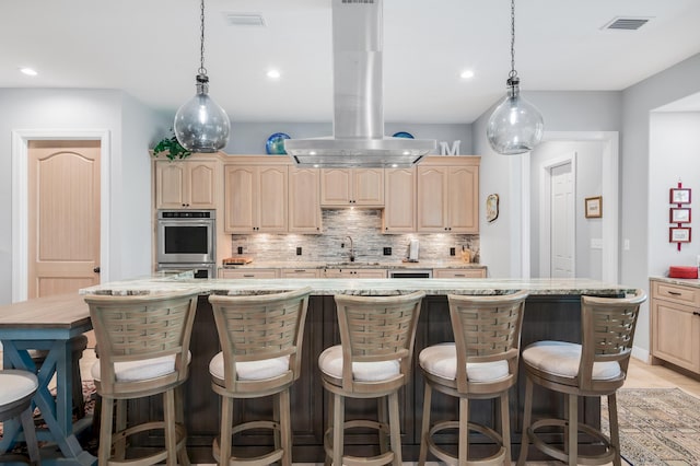 21 S Anchors Lake Dr, Santa Rosa Beach, FL 32459 - kitchen featuring visible vents, light brown cabinetry, recessed lighting, island range hood, and decorative backsplash