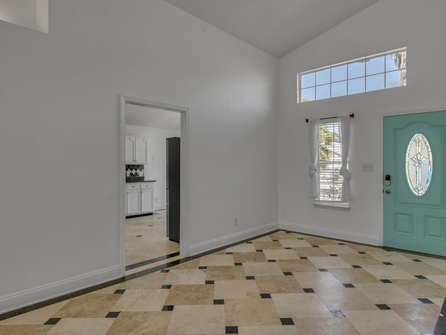 27 Hidden Harbor Ln, Miramar Beach, FL 32550 - foyer featuring high vaulted ceiling and baseboards