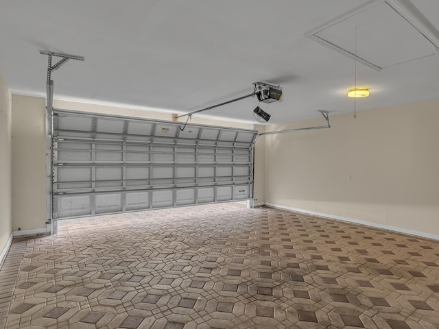 27 Hidden Harbor Ln, Miramar Beach, FL 32550 - garage featuring a garage door opener and baseboards
