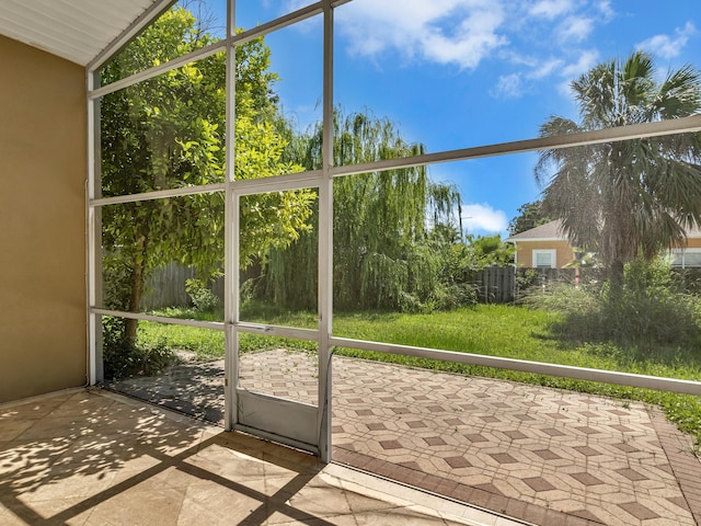 27 Hidden Harbor Ln, Miramar Beach, FL 32550 - unfurnished sunroom with vaulted ceiling