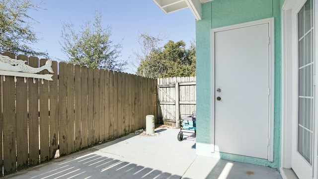view of patio / terrace featuring fence