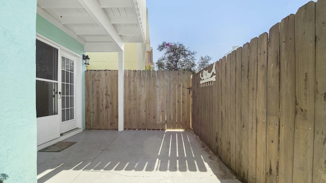 view of patio / terrace featuring fence