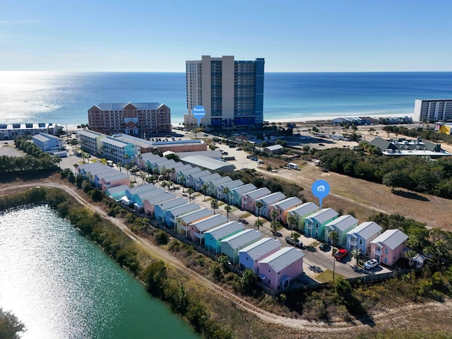 birds eye view of property with a water view and a view of city