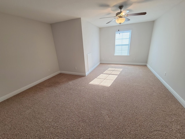 1921 Mooring Dr, Navarre, FL 32566 - empty room with a ceiling fan, light carpet, and baseboards
