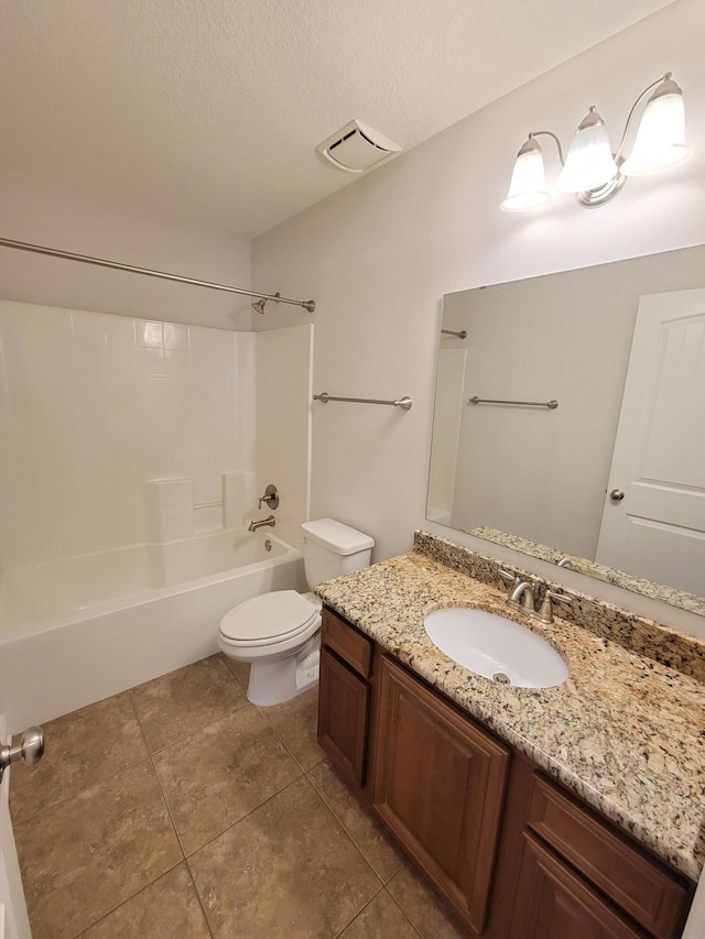 1921 Mooring Dr, Navarre, FL 32566 - bathroom featuring toilet, vanity, tile patterned flooring, a textured ceiling, and shower / tub combination