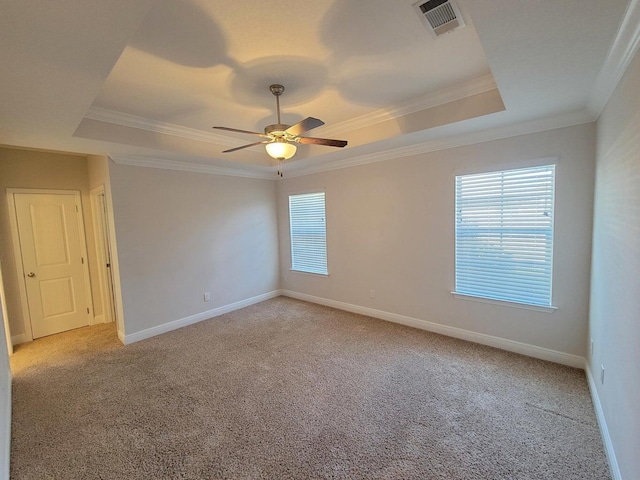 1921 Mooring Dr, Navarre, FL 32566 - empty room featuring a tray ceiling, light colored carpet, ceiling fan, and crown molding