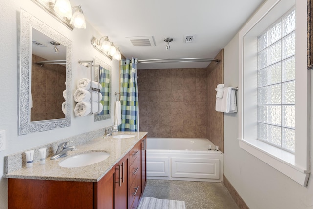bathroom featuring a sink, shower / bathtub combination with curtain, double vanity, and visible vents