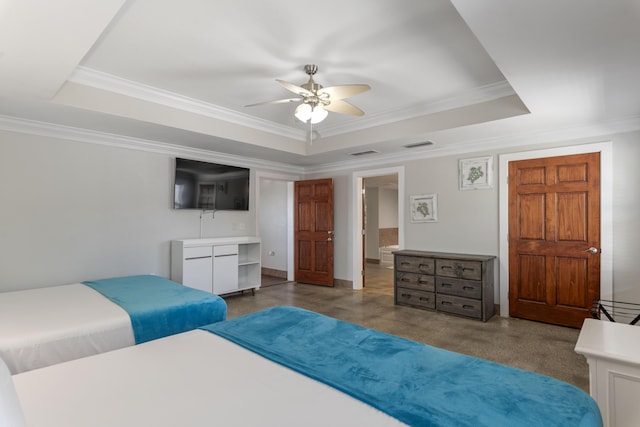 bedroom featuring visible vents, a raised ceiling, and crown molding