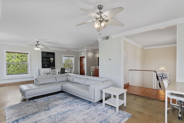living room featuring visible vents, a ceiling fan, baseboards, and crown molding