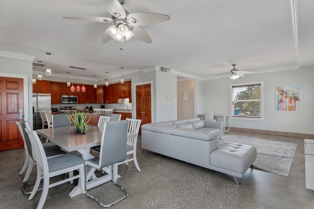 dining space featuring baseboards, ornamental molding, a ceiling fan, and visible vents