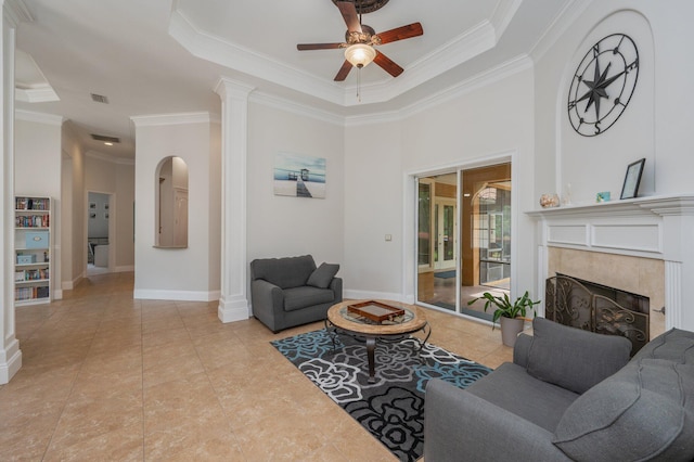 4594 Nautical Ct, Destin, FL 32541 - living area featuring crown molding, ceiling fan, a raised ceiling, a premium fireplace, and baseboards