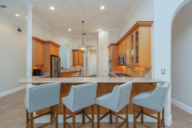 4594 Nautical Ct, Destin, FL 32541 - kitchen with recessed lighting, arched walkways, stainless steel appliances, and a peninsula