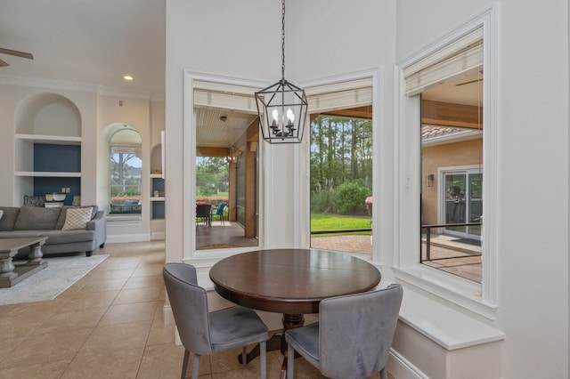 4594 Nautical Ct, Destin, FL 32541 - dining room featuring ornamental molding, baseboards, recessed lighting, built in shelves, and light tile patterned floors