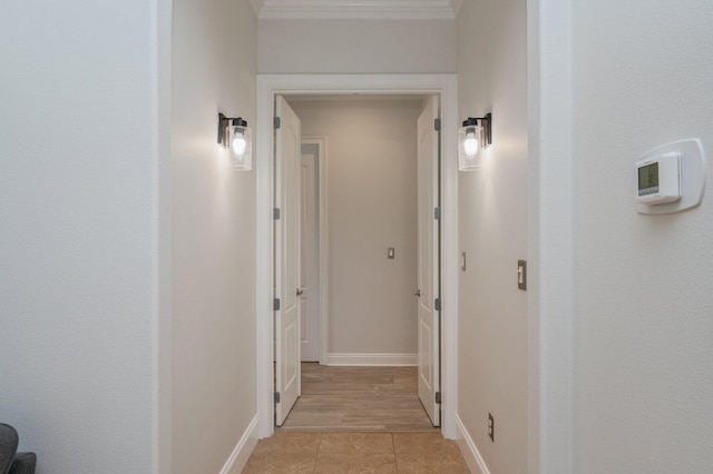 4594 Nautical Ct, Destin, FL 32541 - corridor with light tile patterned floors, baseboards, and crown molding