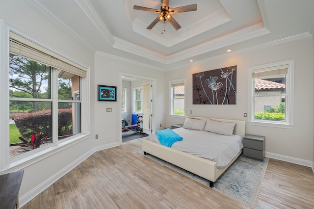 4594 Nautical Ct, Destin, FL 32541 - bedroom featuring baseboards, a tray ceiling, ornamental molding, and wood finished floors